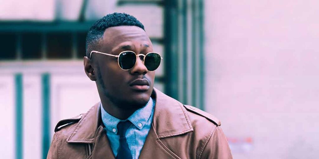 An African American man wearing dapper looking sunglasses